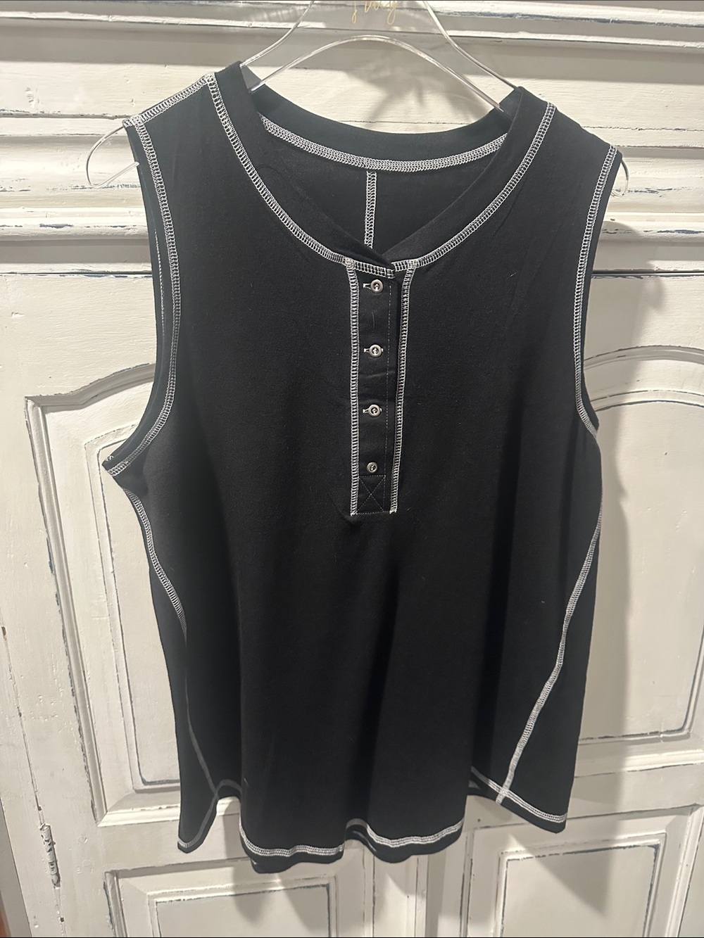 Black Sleeveless Henley Top with Contrast Stitching.